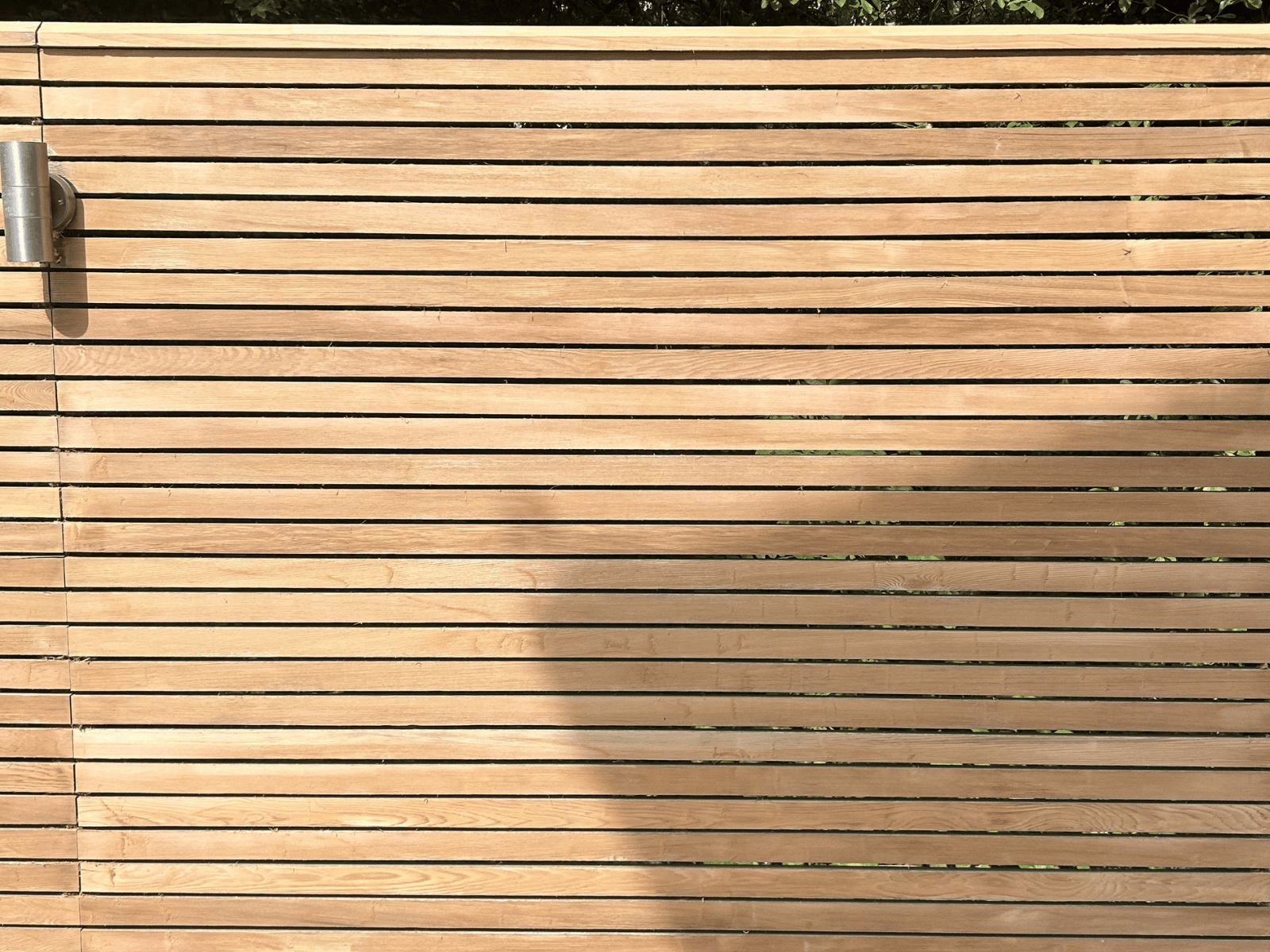 Timber slatted fence after cleaning